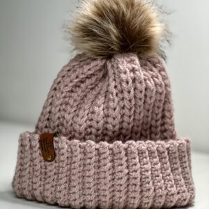 A handmade crochet beanie that has a knit like stitch.