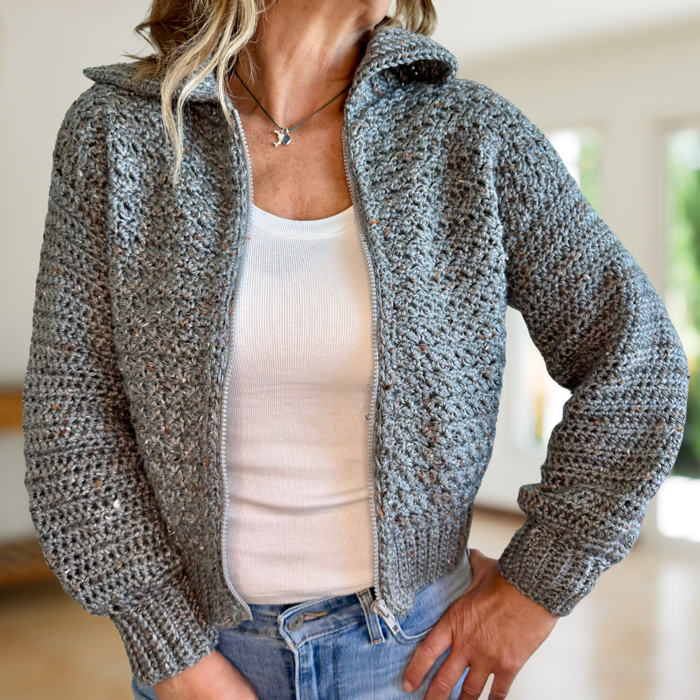 A woman wearing a handmade crochet cardigan