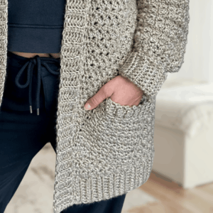 a woman wearing a handmade crochet cardigan