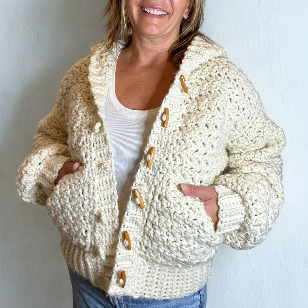 a woman wearing a handmade cardigan
