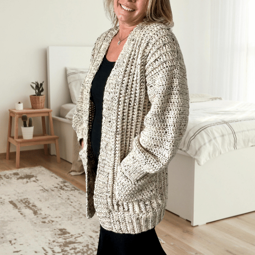 a woman wearing a crochet cardigan