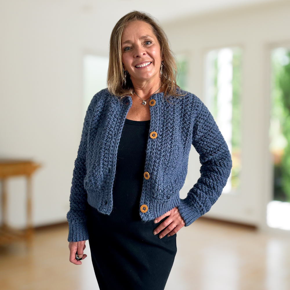 a woman wearing a crochet cardigan