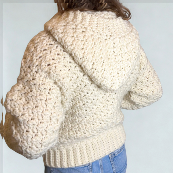 a woman wearing a handmade crochet cardigan