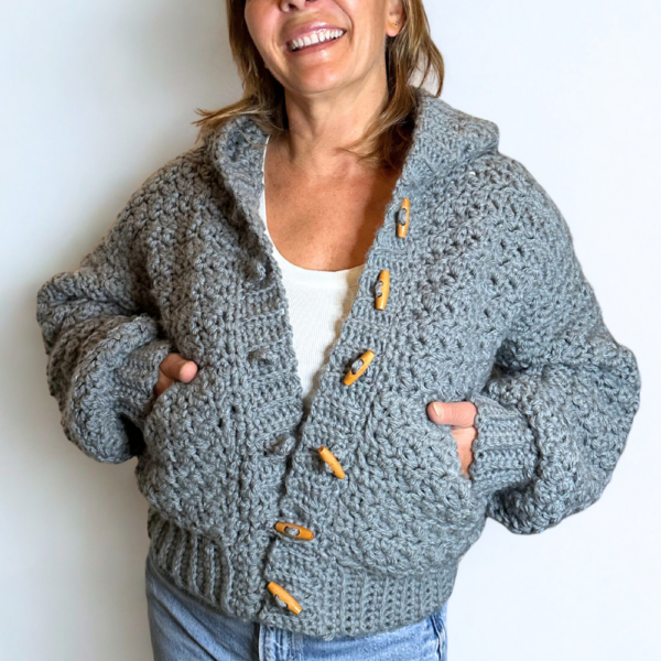 a woman wearing a handmade crochet cardigan