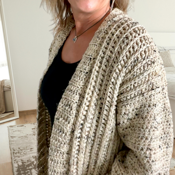 a woman wearing a crochet cardigan