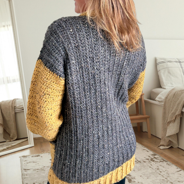 a woman wearing a crochet cardigan