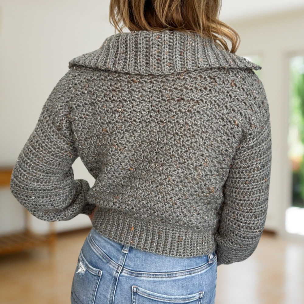 a woman wearing a handmade crochet cardigan