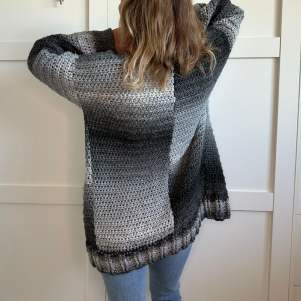 a woman wearing a crochet cardigan