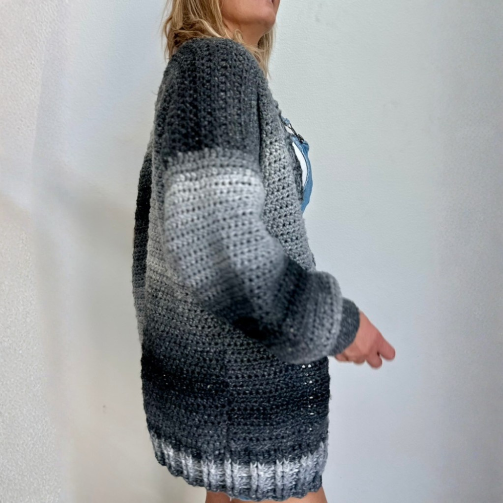 a woman wearing a crochet cardigan