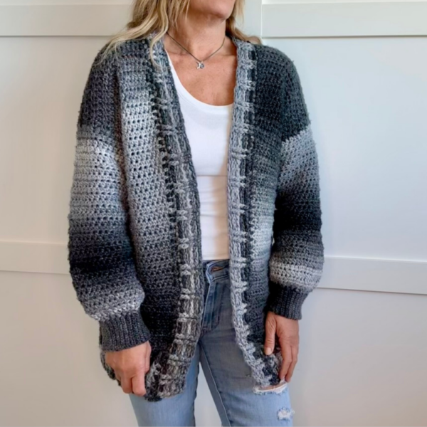a woman wearing a crochet cardigan