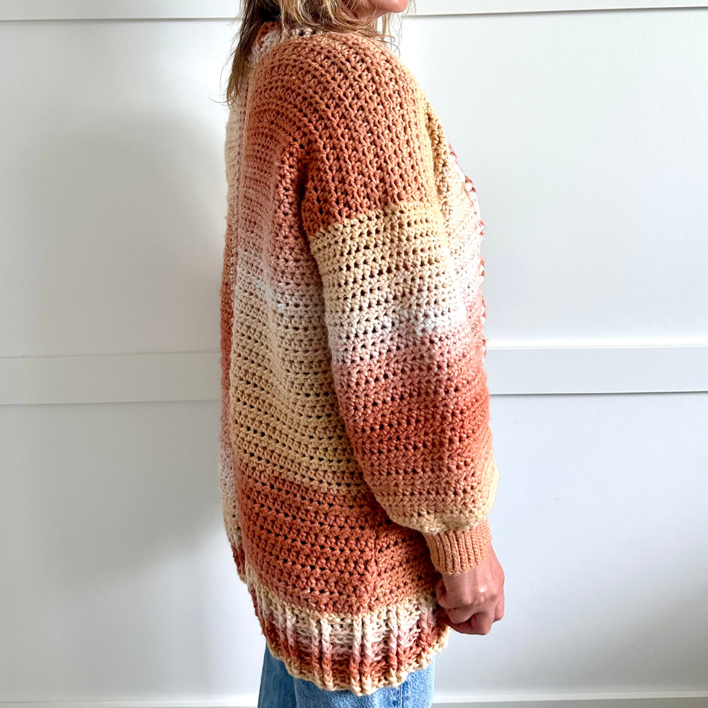 a woman wearing a crochet cardigan