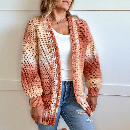 a woman wearing a crochet cardigan