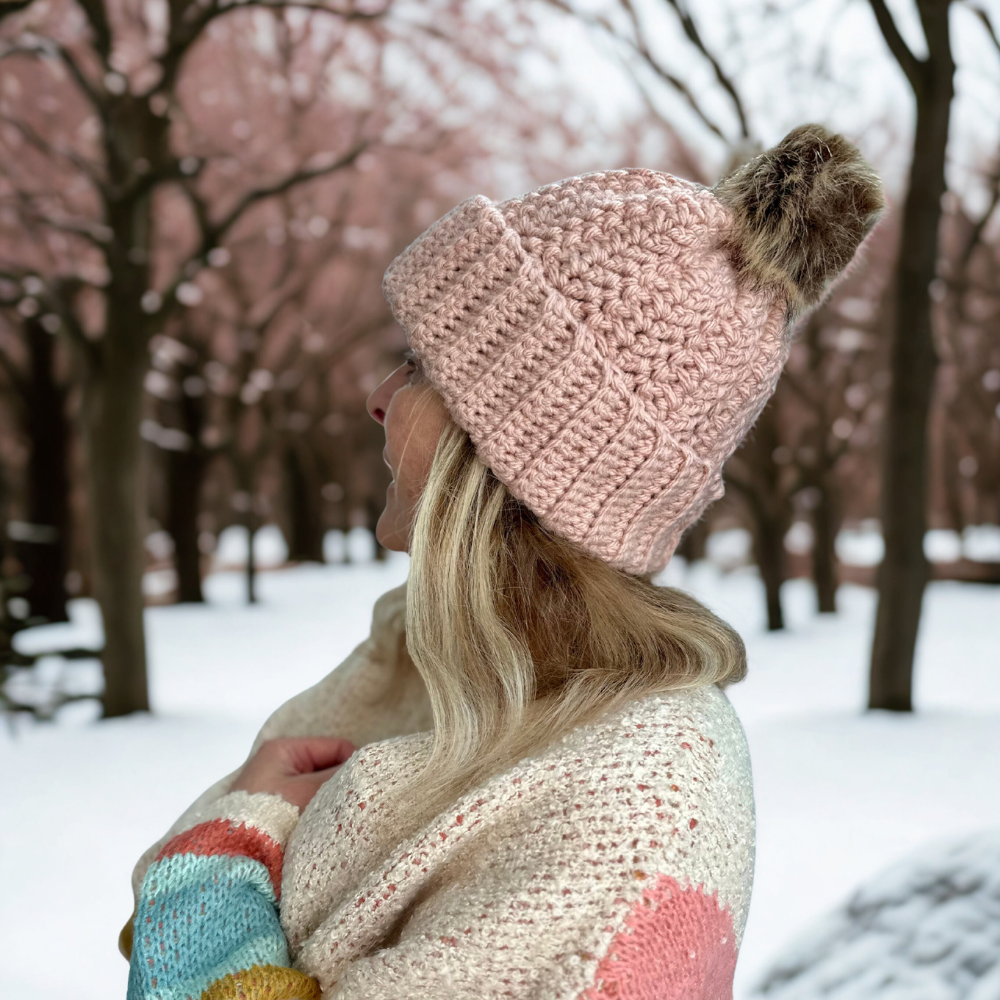 A WOMAN WEARING A CROCHET BEANIE