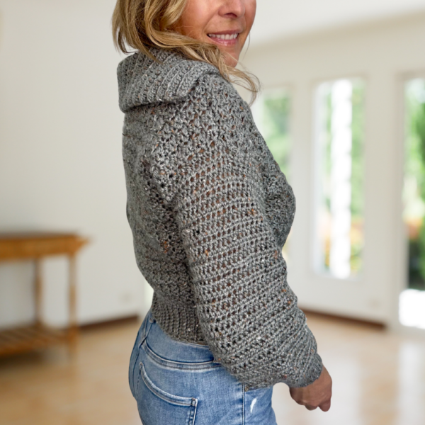 a woman wearing a handmade crochet cardigan