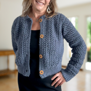 a woman wearing a crochet cardigan