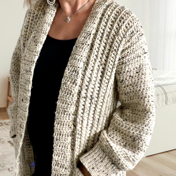 a woman wearing a crochet cardigan