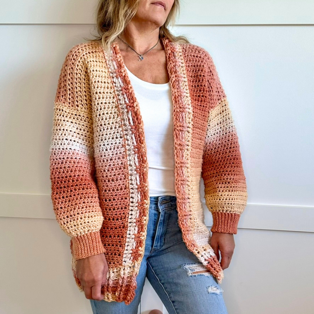 a woman wearing a crochet cardigan