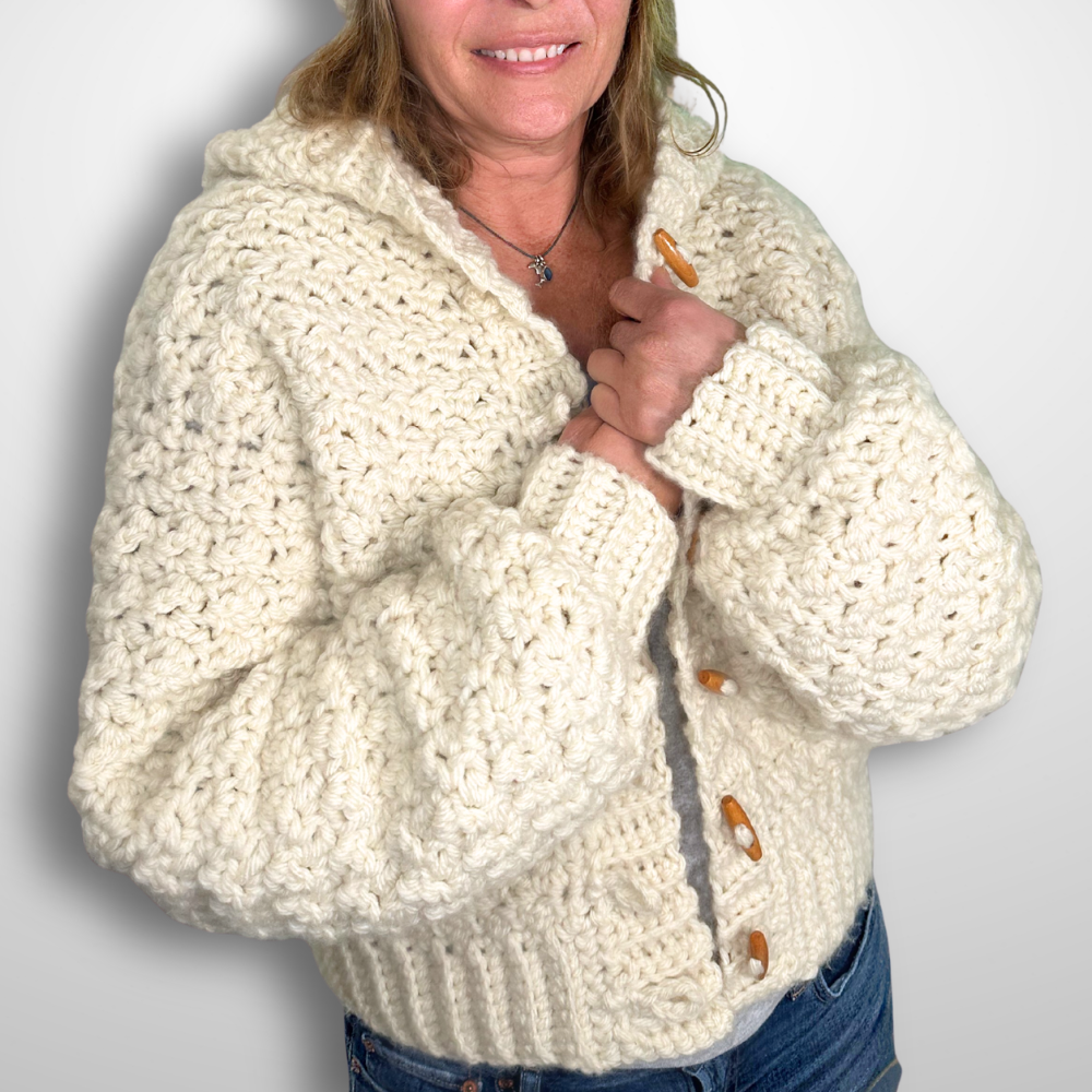 a woman wearing a handmade crochet cardigan