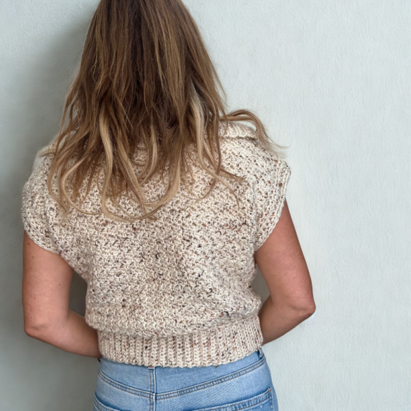 a woman wearing a handmade crochet vest