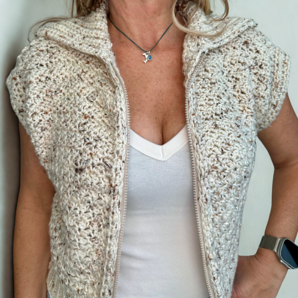 a woman wearing a handmade crochet vest