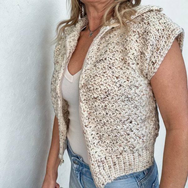 a woman wearing a handmade crochet vest