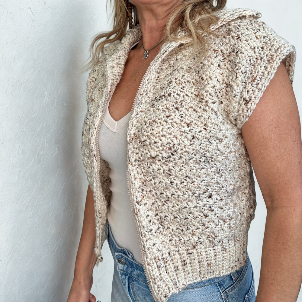 a woman wearing a handmade crochet vest