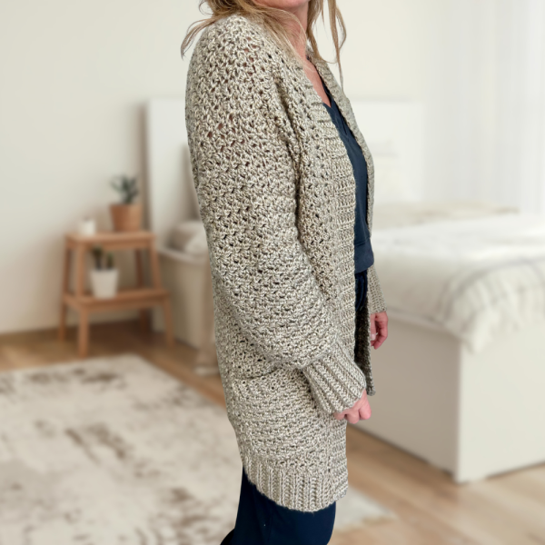 a woman wearing a handmade crochet cardigan