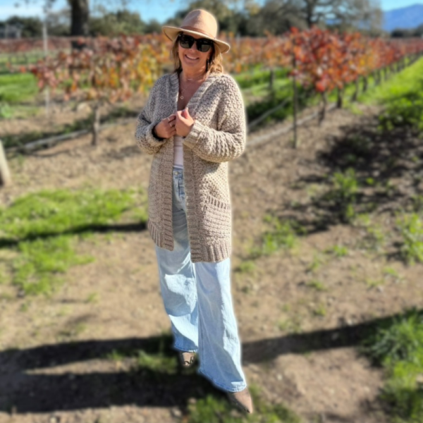 a woman wearing a handmade crochet cardigan