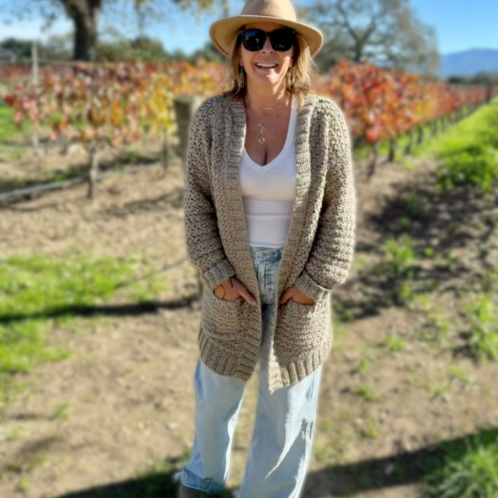 a woman wearing a handmade crochet cardigan