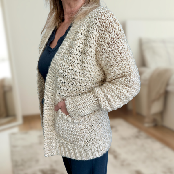 a woman wearing a handmade crochet cardigan