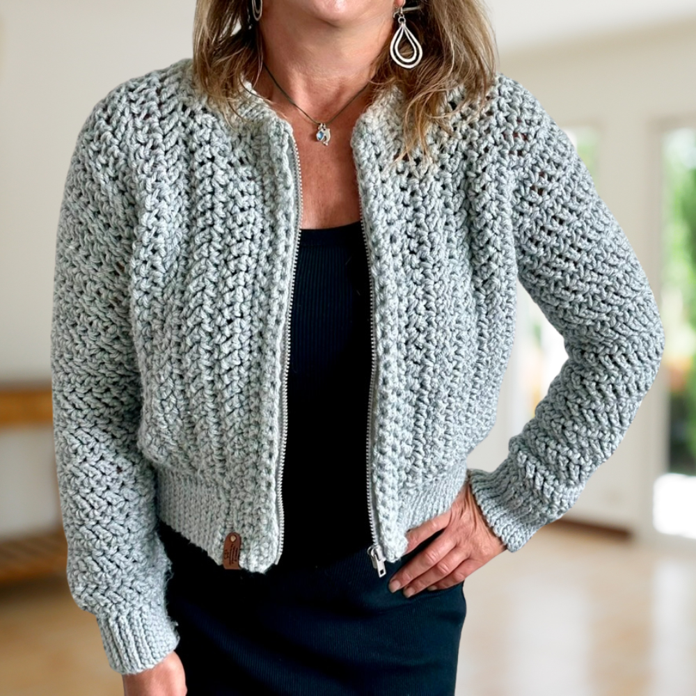 a woman wearing a crochet cardigan