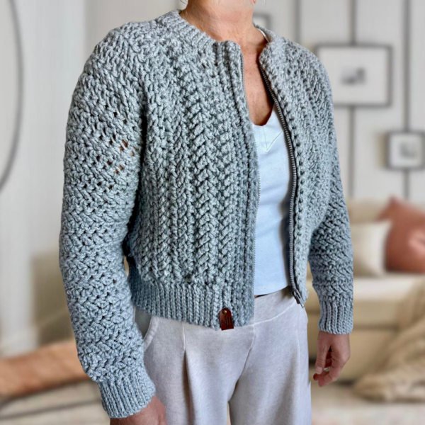 a woman wearing a crochet cardigan