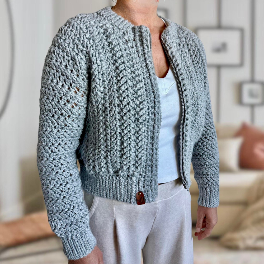 a woman wearing a crochet cardigan