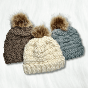 Easy free crochet patterns with 3 crochet beanies laying on a table